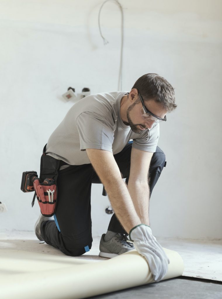 contractor-removing-an-old-linoleum-flooring.jpg